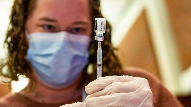 A medical worker prepares the Pfizer Covid-19 vaccine booster to be given to children. Picture: AFP