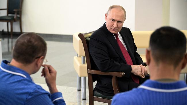 Russian President Vladimir Putin speaks with participant of the military operation in Ukraine at a Moscow military hospital. Pivture: AFP