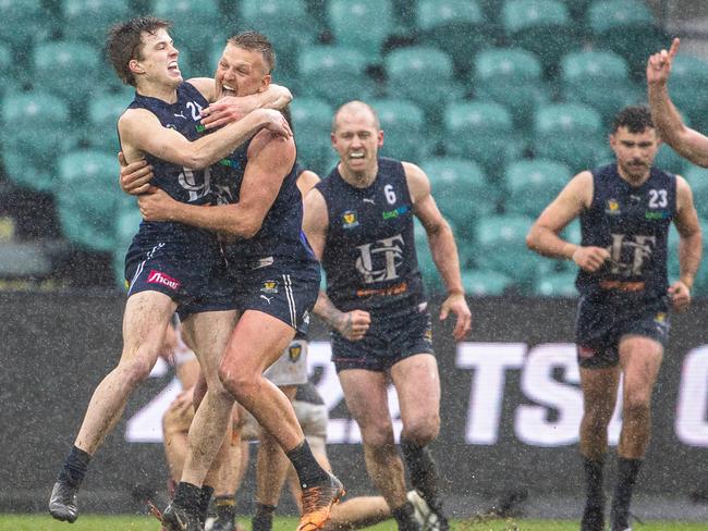 New Launceston coach Jake Hinds (right) huges Bailey Gillow after the Blues won the 2022 TSL grand fianl. Picture: Linda Higginson