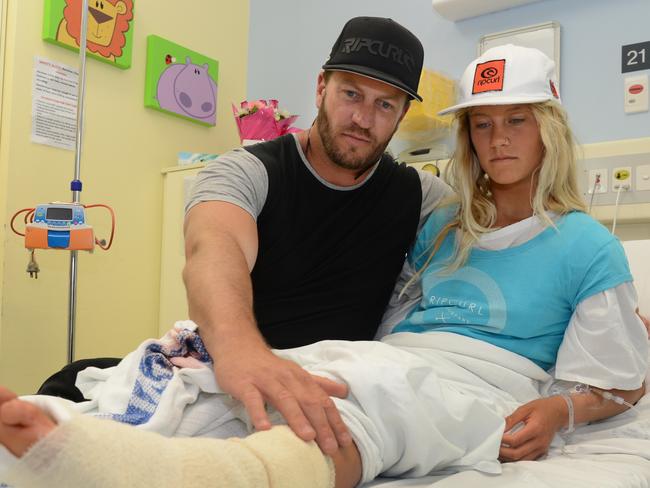 Shark bite victim Kirra-Belle Olsson with her father Jamie Olsson, recovering in Gosford Hospital after being bitten on the leg at Avoca Beach. Picture: News Corp Australia