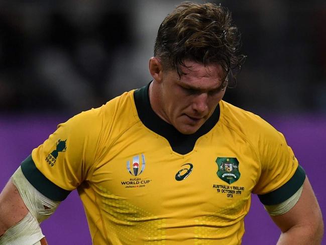 (FILES) This file photo taken on October 19, 2019 shows Australia's flanker Michael Hooper reacting after losing the Japan 2019 Rugby World Cup quarter-final match between England and Australia at the Oita Stadium in Oita. - With the Wallabies languishing at seventh in the world rankings, Rugby Australia's leadership in flux and the sport facing fierce competition from other codes, the coronavirus pandemic in 2020 has turned long-standing problems with rugby Down Under into a battle for survival. (Photo by CHARLY TRIBALLEAU / AFP)