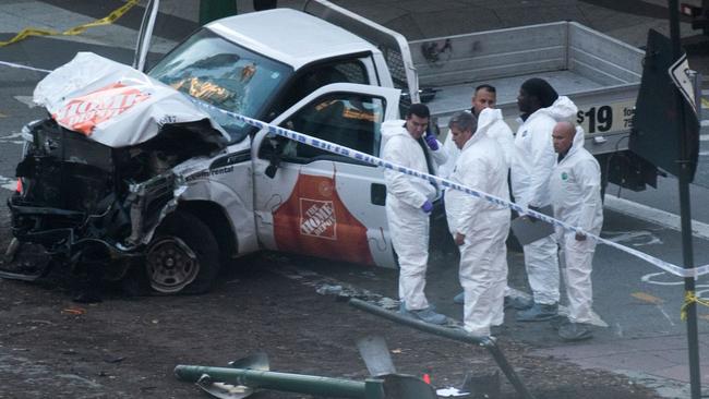 Investigators inspect the truck used in the New York rampage. Picture: AFP