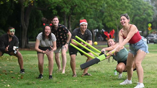 Richard Hutton and a group of friends from the UK still happy despite the weather in Brisbane. Photo: Lyndon Mechielsen