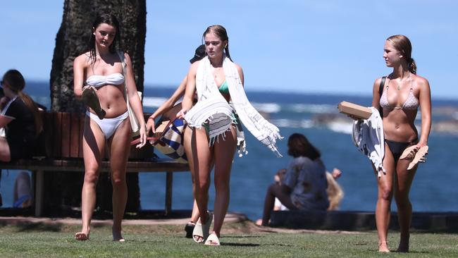 Schoolies return from a dip at Clarkes Beach in Byron Bay. Photograph: Jason O'Brien
