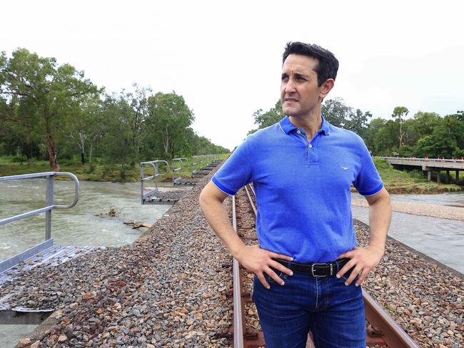 Premier of Queensland David Crisafulli crosses the Ollera Creek which has been destroyed by flood water so he can make his way into Ingham. Picture: Adam Head