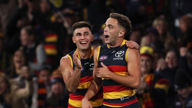 ADELAIDE, AUSTRALIA - MAY 02: Lachlan Sholl and Josh Rachele of the Crows celebrate a goal during the 2024 AFL Round 08 match between the Adelaide Crows and the Port Adelaide Power at Adelaide Oval on May 02, 2024 in Adelaide, Australia. (Photo by James Elsby/AFL Photos via Getty Images)