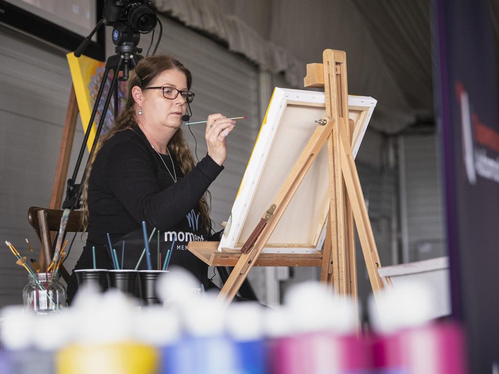 ANZACARTA art therapist Sarah Hazelhurst leads the World's Largest Paint and Sip Luncheon for Momentum Mental Health at Clifford Park racecourse, Friday, June 21, 2024. Picture: Kevin Farmer