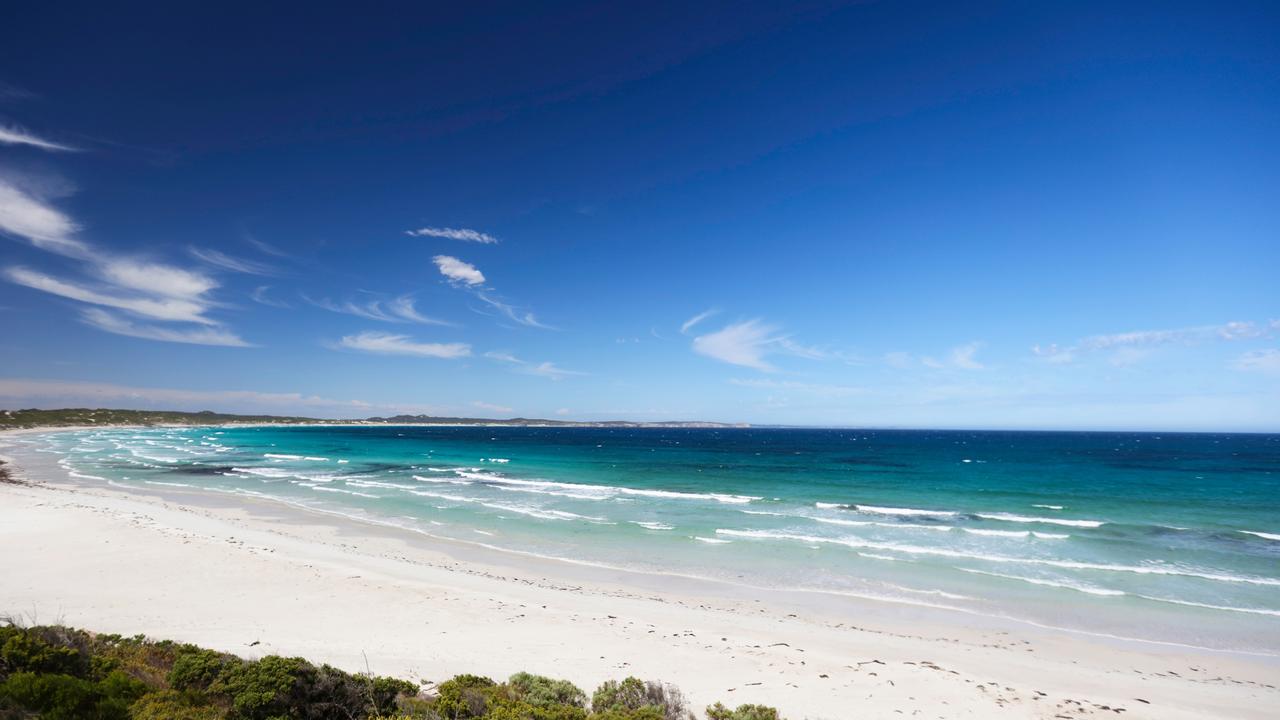 The white pristine beach and blue waters of Vivonne Bay.