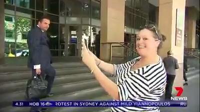 Kate Fischer takes selfies outside Melbourne court