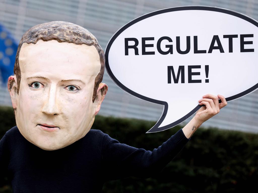 A protester outside the EU building calling for the regulation of Facebook. Picture: Kenzo Tribouillard / AFP