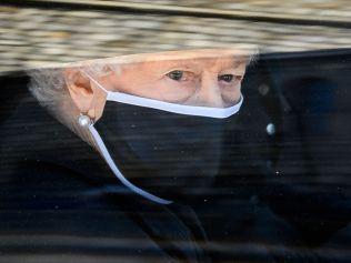 Britain's Queen Elizabeth II travels in the State Bentley during the ceremonial funeral procession of Britain's Prince Philip, Duke of Edinburgh to St George's Chapel in Windsor Castle in Windsor, west of London, on April 17, 2021. - Philip, who was married to Queen Elizabeth II for 73 years, died on April 9 aged 99 just weeks after a month-long stay in hospital for treatment to a heart condition and an infection. (Photo by LEON NEAL / various sources / AFP)