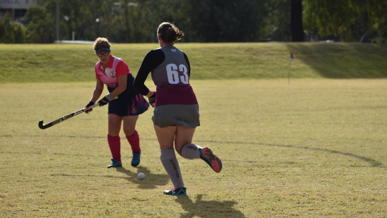 Janet Tancred (Toowoomba) and Heather French (Gladstone) on field at the 2021 Queensland Hockey Women's Masters Championships in Warwick.