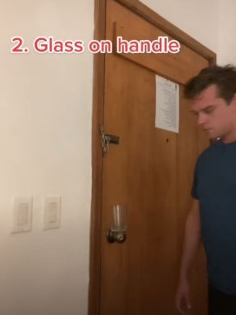 A glass balanced on a door knob will fall if someone tries to open the door, alerting you. Picture: DutchintheUSA