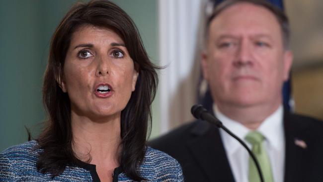 Secretary of State Mike Pompeo looks on as US Ambassador to the UN Nikki Haley reveals the US withdrawal from the UN Human Rights Council. Picture: AFP