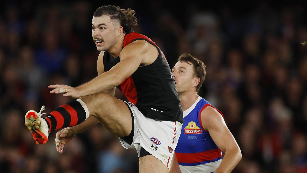 MELBOURNE , AUSTRALIA. April 12, 2024. AFL. Round 5. Western Bulldogs vs Essendon at Marvel Stadium. Sam Draper of the Bombers clears out of the middle during the 2nd qtr. . Pic: Michael Klein