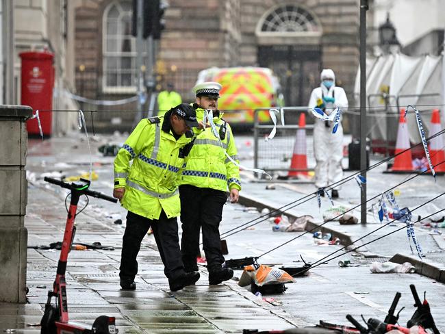 Police and forensics officers work at the scene on Water Street in Liverpool, northwest England. Picture: AFP