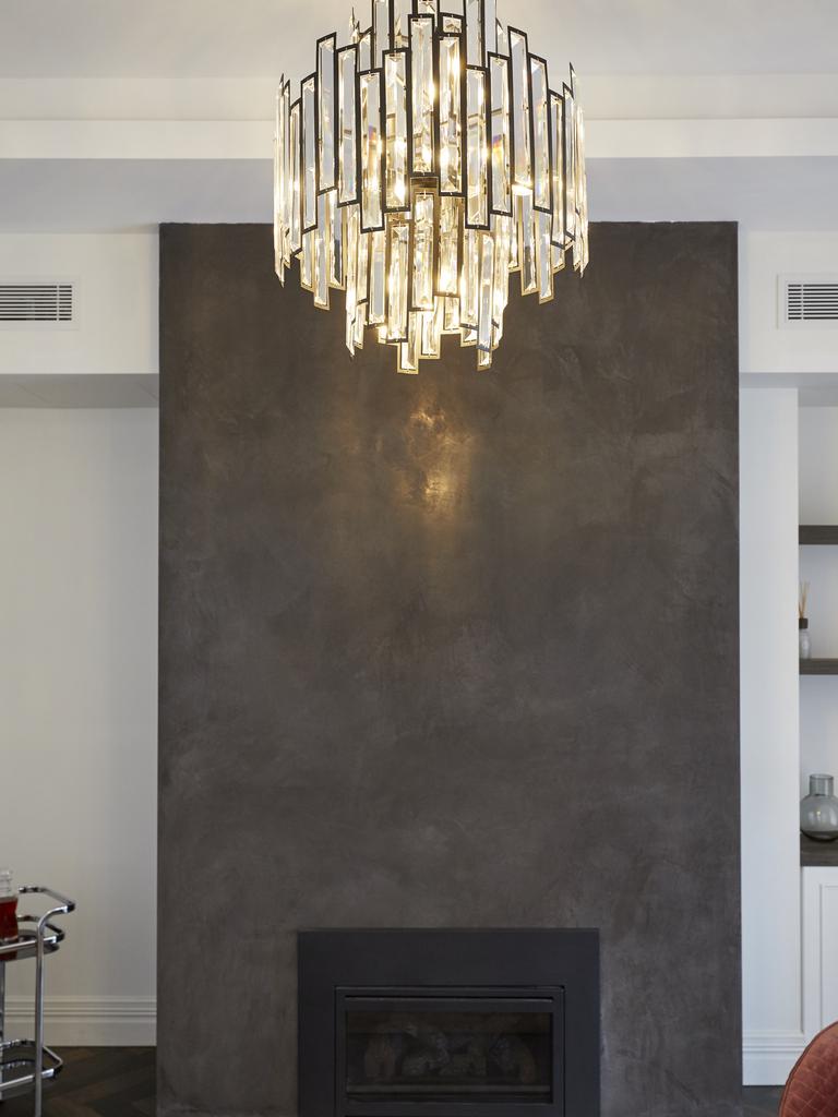 They loved this chandelier but said it could have been bigger to reflect off the fireplace wall. Picture: The Block