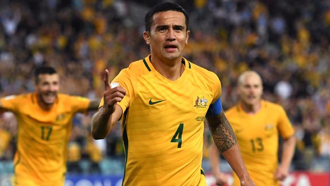 Tim Cahill celebrates scoring the winner against Syria.