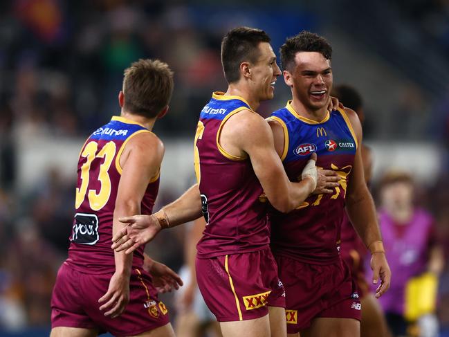 Cameron Rayner and Hugh McCluggage enjoy a Lions goal. Picture: Chris Hyde/AFL Photos/via Getty Images