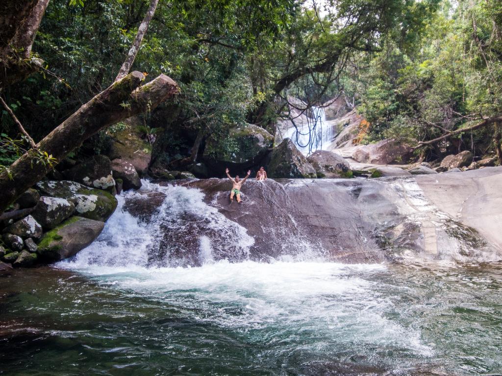 <b>JOSEPHINE FALLS, BABINDA, QUEENSLAND: </b>Who can resist the delights of a waterhole with its own natural waterslide? Josephine Falls sits amid lush tropical rainforest at the base of Queensland’s tallest mountain, Mt Bartle Frere, south of Cairns. There are viewing platforms overlooking the picturesque falls but the real highlight is cooling off at the base where steep granite rocks form a slippery slide into the pool. Flash flooding can occur in the wet season, so check the national parks advice before your visit. <a href="http://npsr.qld.gov.au/parks/wooroonooran-josephine-falls/" target="_blank">npsr.qld.gov.au/parks/wooroonooran-josephine-falls </a>Picture: Tourism Tropical North Queensland