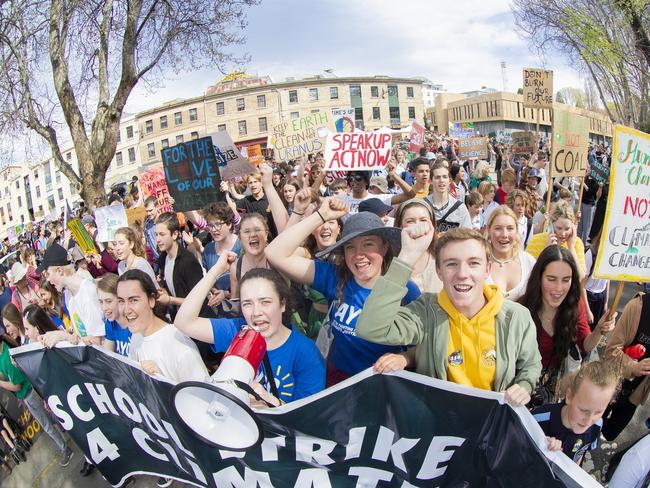 Bryher Mckewin (with mic) , Amelie Hudspeth and Toby Thorpe. Climate strike rally in Hobart. Picture: RICHARD JUPE