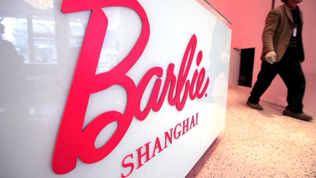 FILE - In this March 6, 2009 file photo, a worker walks in the "House of Barbie" in Shanghai, China. In 2009, Mattel opened the flagship Barbie store but closed it after just two years. (AP Photo/Eugene Hoshiko, File)