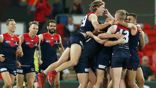 Melbourne celebrate the win.