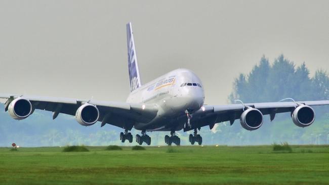 FILE: The Airbus A380 passenger plane lands at Changi Airport in Singapore after completing its first overseas test flight with a thirteen-hour journey from the company's headquarters in Toulouse to Singapore on Friday, November 11, 2005. Airbus SE decided to stop making the A380 double-decker after a dozen years in service, burying a prestige project that won the hearts of passengers and politicians but never the broad support of airlines that instead preferred smaller, more fuel-efficient aircraft. Production of the jumbo jet will end by 2021, after the A380’s biggest customer, Emirates, and a handful of remaining buyers receive their last orders. Photographer: Jonathan Drake/Bloomberg