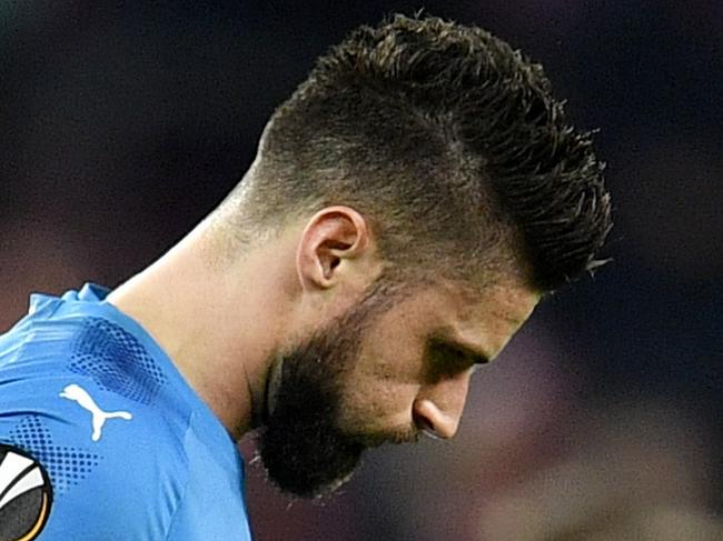 Arsenal's Olivier Giroud leaves the pitch after his team lost during the soccer Europa League group H match between FC Cologne and Arsenal in Cologne, Germany, Thursday, Nov. 23, 2017. (AP Photo/Martin Meissner)