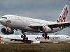  A Virgin Australia A330-200 lands past a former QANTAS now Jetstar A330-200 (VH-EBC) at Melbourne Airport. 