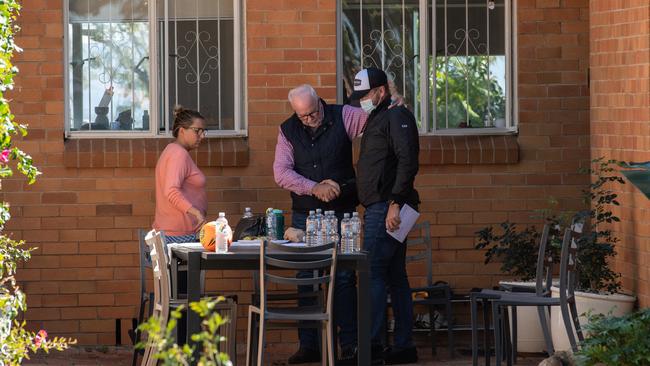 Family connections thank a neighbour, right, who held down one of the home invaders . Picture: Brad Fleet