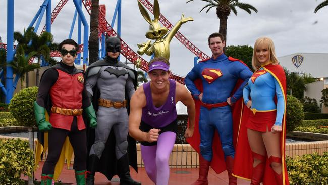 Kyle Wisniewski with Robin, Batman Superman and Super Girl at Movie World. Kyle is getting ready for his Superhero Run for Brain Cancer on June 16. Picture: Village Roadshow Theme Parks