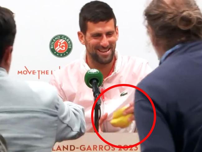 Novak Djokovic was handed a banana by the journalist. Pic: Eurosport