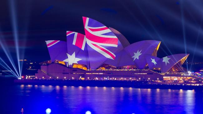 The Opera House illuminated in the colours of the Australian flag in Sydney on Australia Day on January 26, 2023. (Photo by Robert Wallace / AFP)