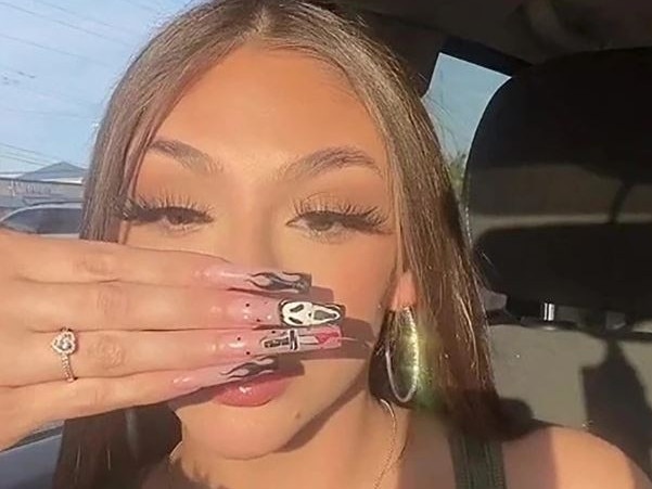 Tess participated in a trend where you use your hand to “cover what ruins your face". Picture: TikTok