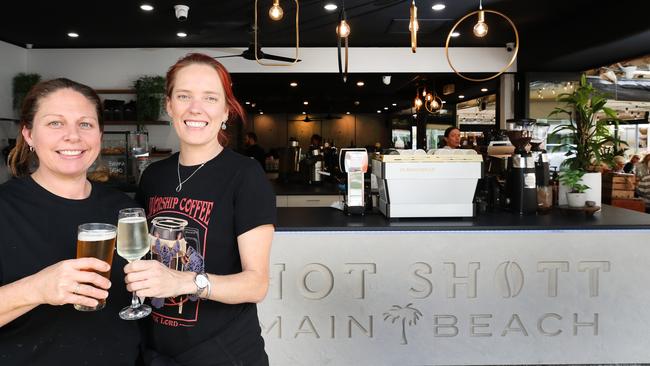 Hot Shott Cafe Owners Kellie and Jenna Rolfe toast the opening of the new extension to their successful Main Beach cafe.