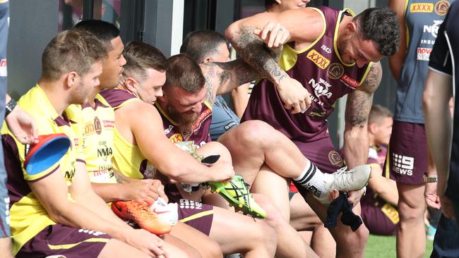 Josh McGuire and Darius Boyd horse around at Broncos training. Picture: Annette Dew