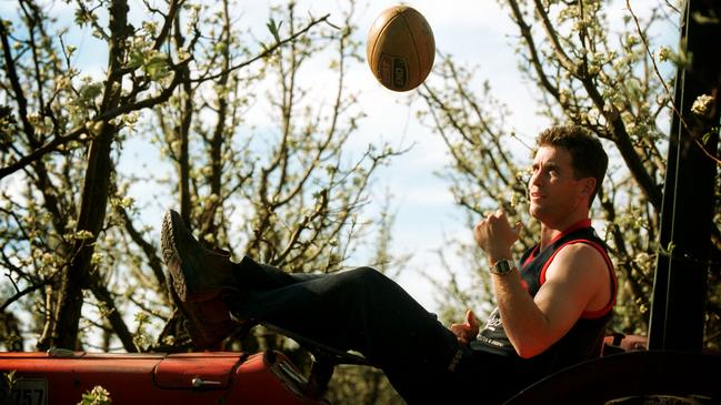 Brett James at his family’s Kersbrook orchard during his playing days.