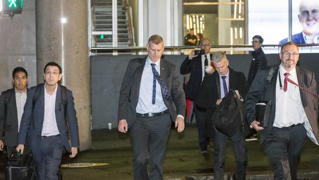 AFP officers leave the ABC after raiding the Sydney offices. Picture: Damian Shaw