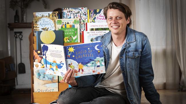 Blake Nuto with his new book titled Child of Galaxies at South Hobart. Picture Chris Kidd