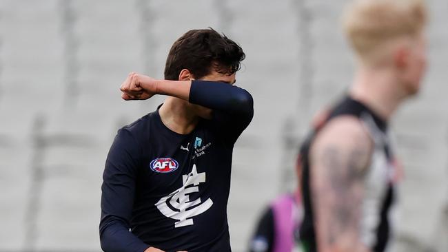 Jack Silvagni kisses his armband after kicking a goal in Carlton’s comeback win.