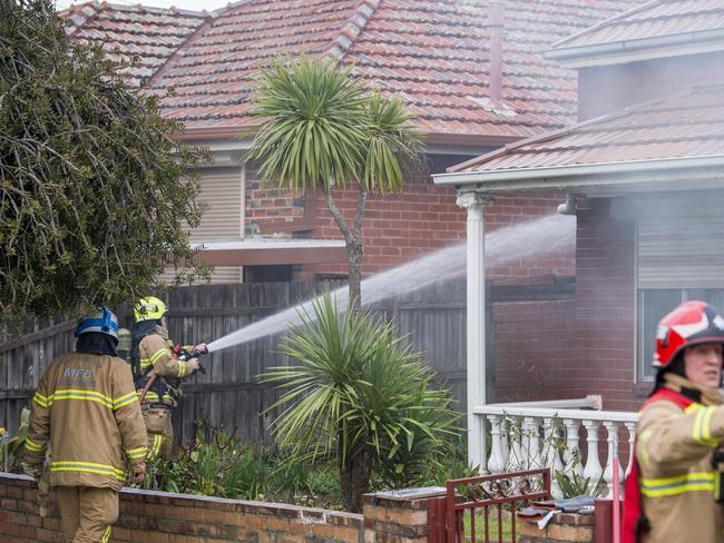 Firefighters battle the blaze. Picture: Jason Edwards