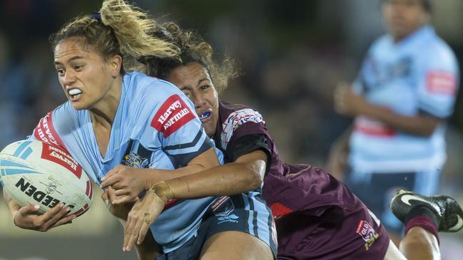 Tallisha Harden of the Maroons tackles Nita Maynard of the Blues during the Women's State of Origin match in Sydney on June 22, 2018. (AAP Image/Craig Golding)