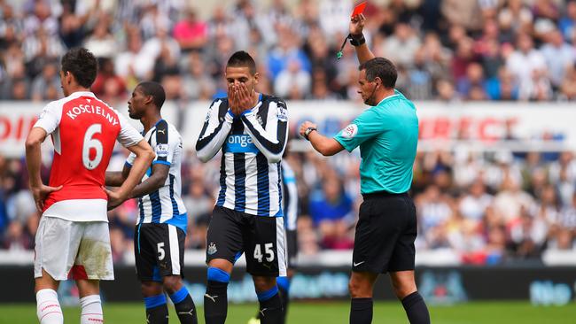 NEWCASTLE UPON TYNE, ENGLAND - AUGUST 29: Aleksandar Mitrovic (2nd R) of Newcastle United is shown a red card by referee Andre Marriner (1st R) during the Barclays Premier League match between Newcastle United and Arsenal at St James' Park on August 29, 2015 in Newcastle upon Tyne, England. (Photo by Stu Forster/Getty Images)