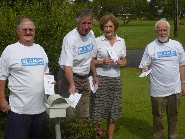 Peter Barnett, Dave Hughes, Jennifer Meehan and Patrick Coughlan posting awareness leaflets. Photo: Veronica Coughlan