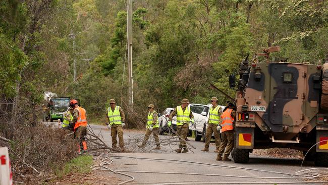 ADF help in the clean up at Kriedeman Road in Wongawallan after ferocious storms dame the Gold Coast area. Pics Adam Head