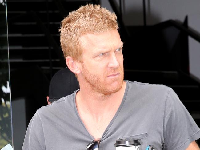 Essendon AFL players attending a meeting at the AFL Players association in Albert Park. Dustin Fletcher, right, leaves. Picture:Alex Coppel.