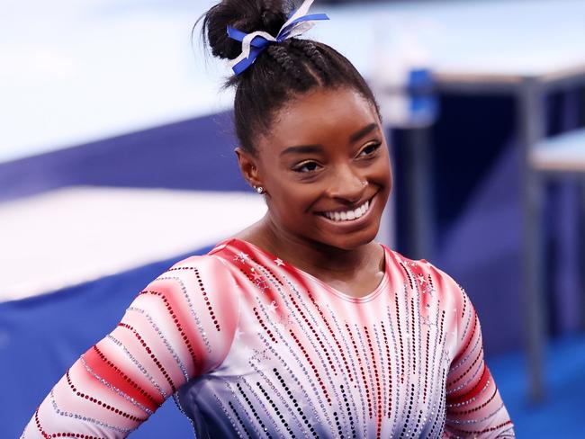 Biles reveals hidden family tragedy