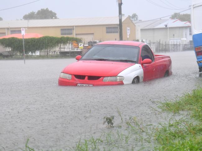 A car partly submerged in Camgulia Street, Mt Louisa in Townsville. Picture: Evan Morgan