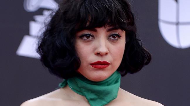 EDITORS NOTE: Graphic content / Chilean singer Mon Laferte, exposes her chest with writings reading "In Chile they torture, rape and kill", as she arrives at the 20th Annual Latin Grammy Awards in Las Vegas, Nevada, on November 14, 2019. (Photo by Bridget BENNETT / AFP) / ALTERNATE CROP